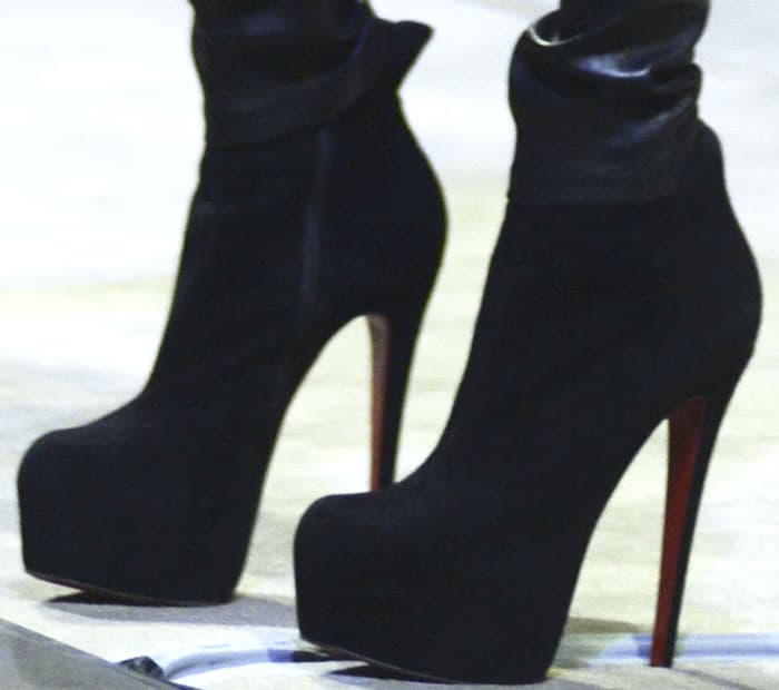 Michelle towers on stage in the Christian Louboutin "Daf Booty" suede ankle boots